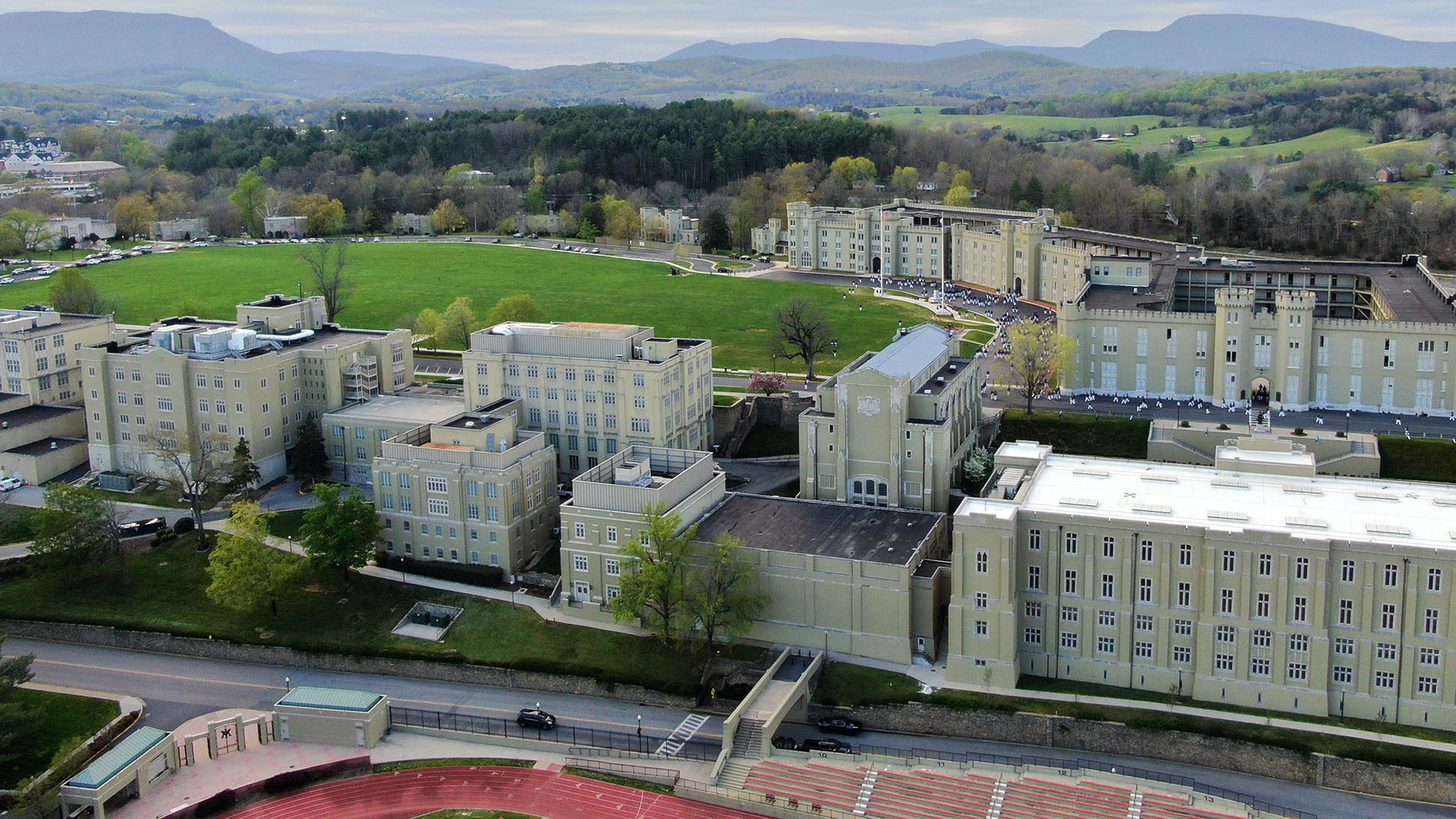 aerial shot of academic row, Parade Ground and barracks with mountains in background