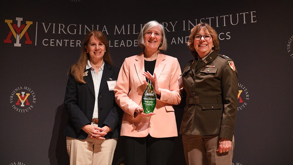 Margaret L. “Peggy” Sanner, Chesapeake Bay Foundation Virginia executive director, flanked by last year’s winner, Laura McKay, and Lt. Col. Kim Connolly, accepts the Erchul Environmental Leadership Award.