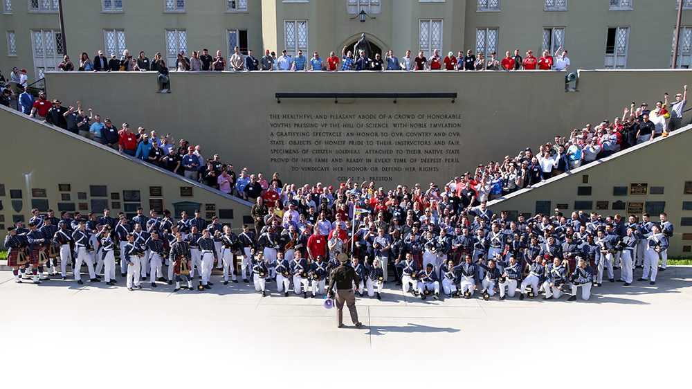 Band company alumni gathered on the steps of the parapet